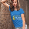 mockup of a young woman wearing a customizable t shirt and leaning against a brick wall 2764 el1
