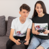 t shirt mockup featuring a kid and his mom playing video games 31427
