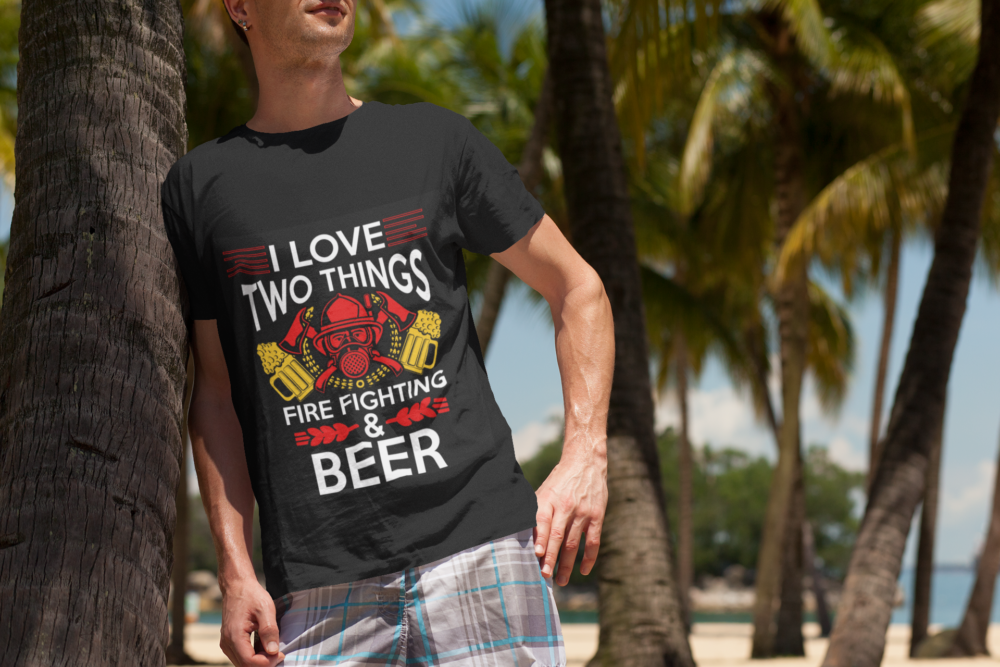 t shirt mockup of a man at the beach leaning on a palm tree 2750 el1