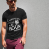 t shirt mockup of a muscular man posing against a wall 2245 el1