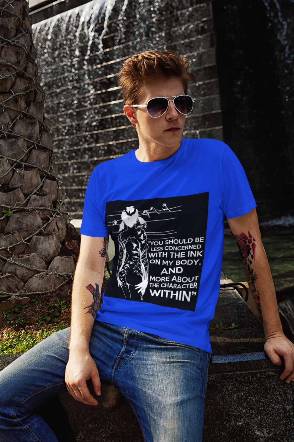 t shirt mockup of a red haired man posing next to a fountain 2191 el1 2 1