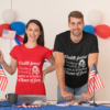 t shirt mockup of a woman and a man in a polling station 31920