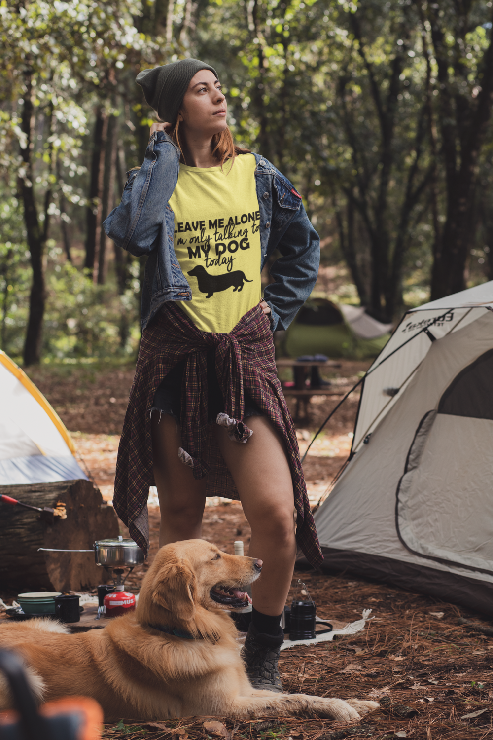 t shirt mockup of a woman at a camping site with her dog 30462