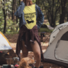 t shirt mockup of a woman at a camping site with her dog 30462
