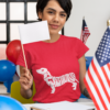 t shirt mockup of a woman holding a flag at a political polling station 31944