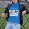 t shirt mockup of a woman leaning on a fence 32056