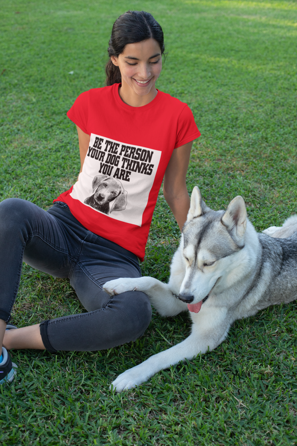 t shirt mockup of a woman sitting on the grass with her dog 30659