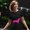 t shirt mockup of a young woman standing against a dark background with some plants 411 el